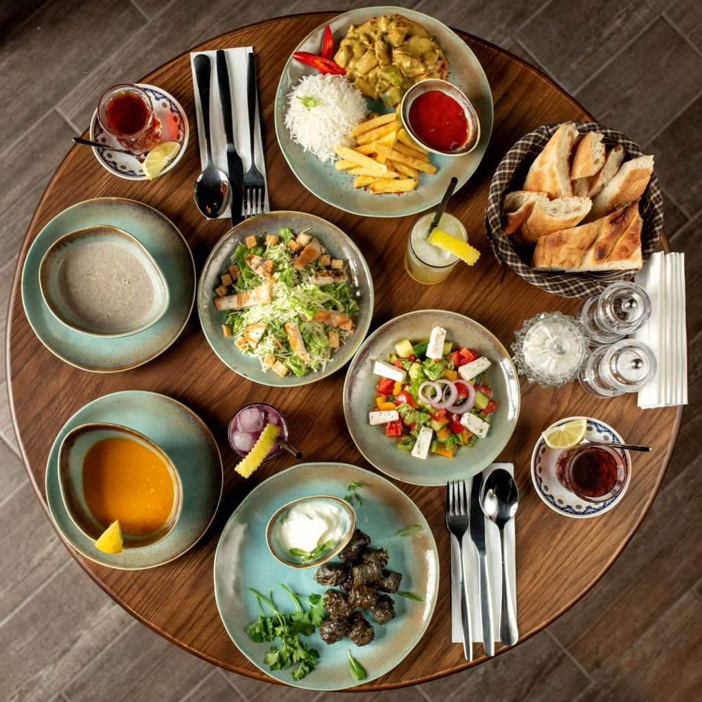 dinner-set-with-dolma-soups-salads-chicken-with-rice-french-fries-scaled.jpg